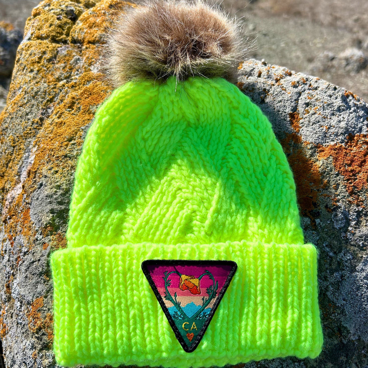 Neon yellow Kooh Culture faux fur pom beanie with the Poppy CA Love patch