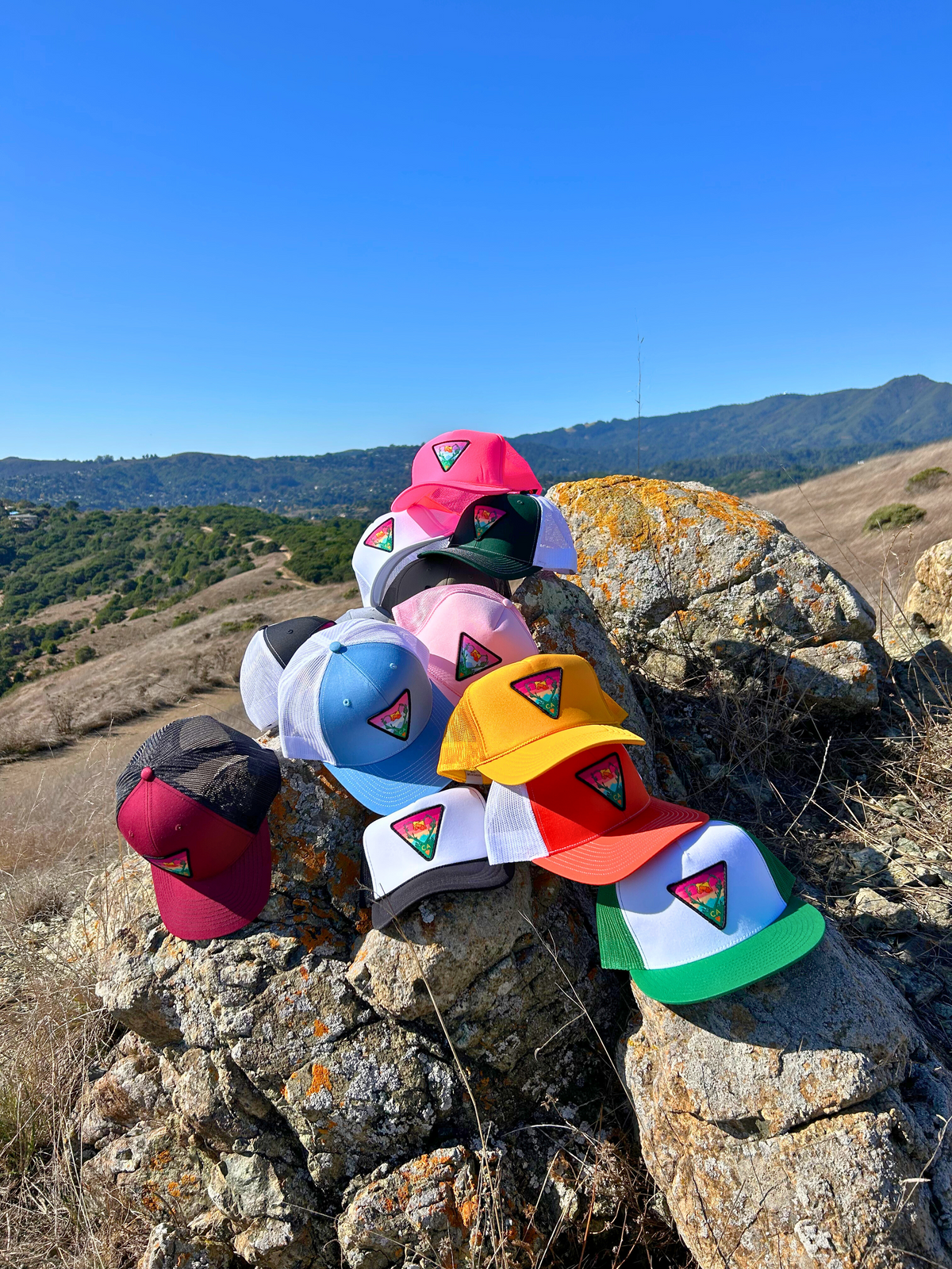 White and green Kooh Culture flat brim trucker hat with the Poppy CA Love patch, alternate view