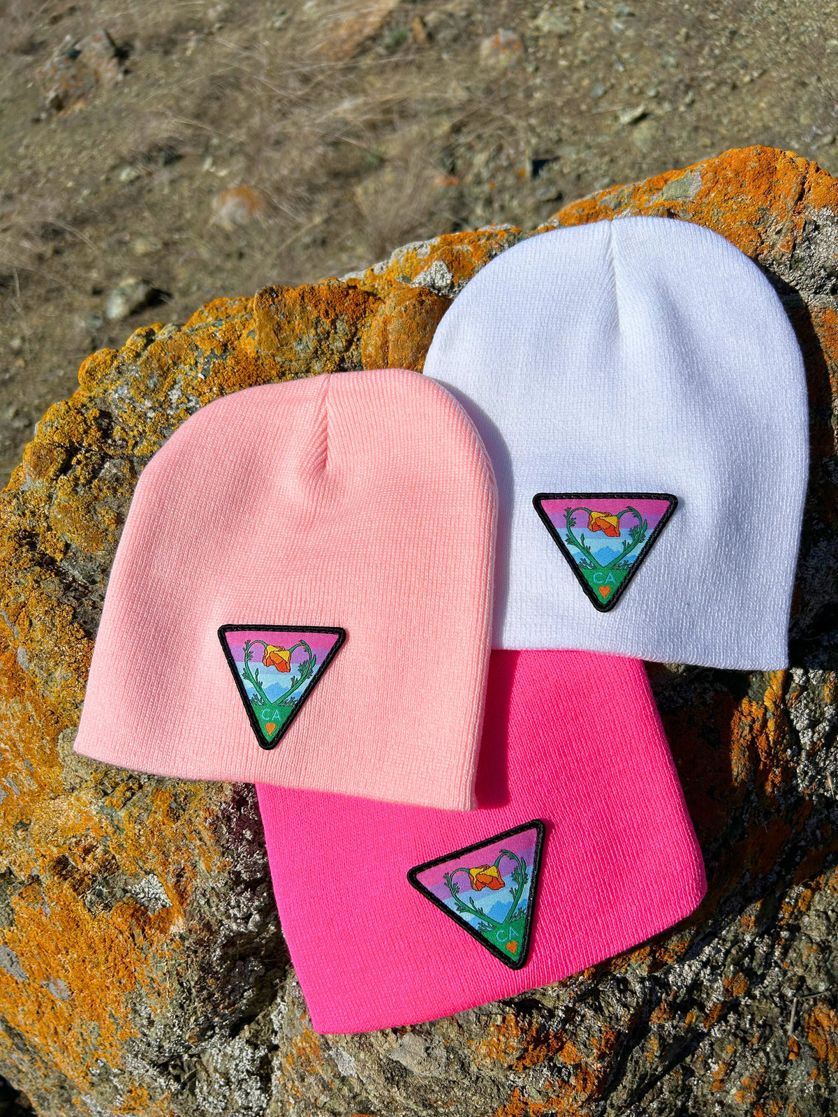 Neon pink Kooh Culture cuffed beanie with the Poppy CA Love patch, alternate view