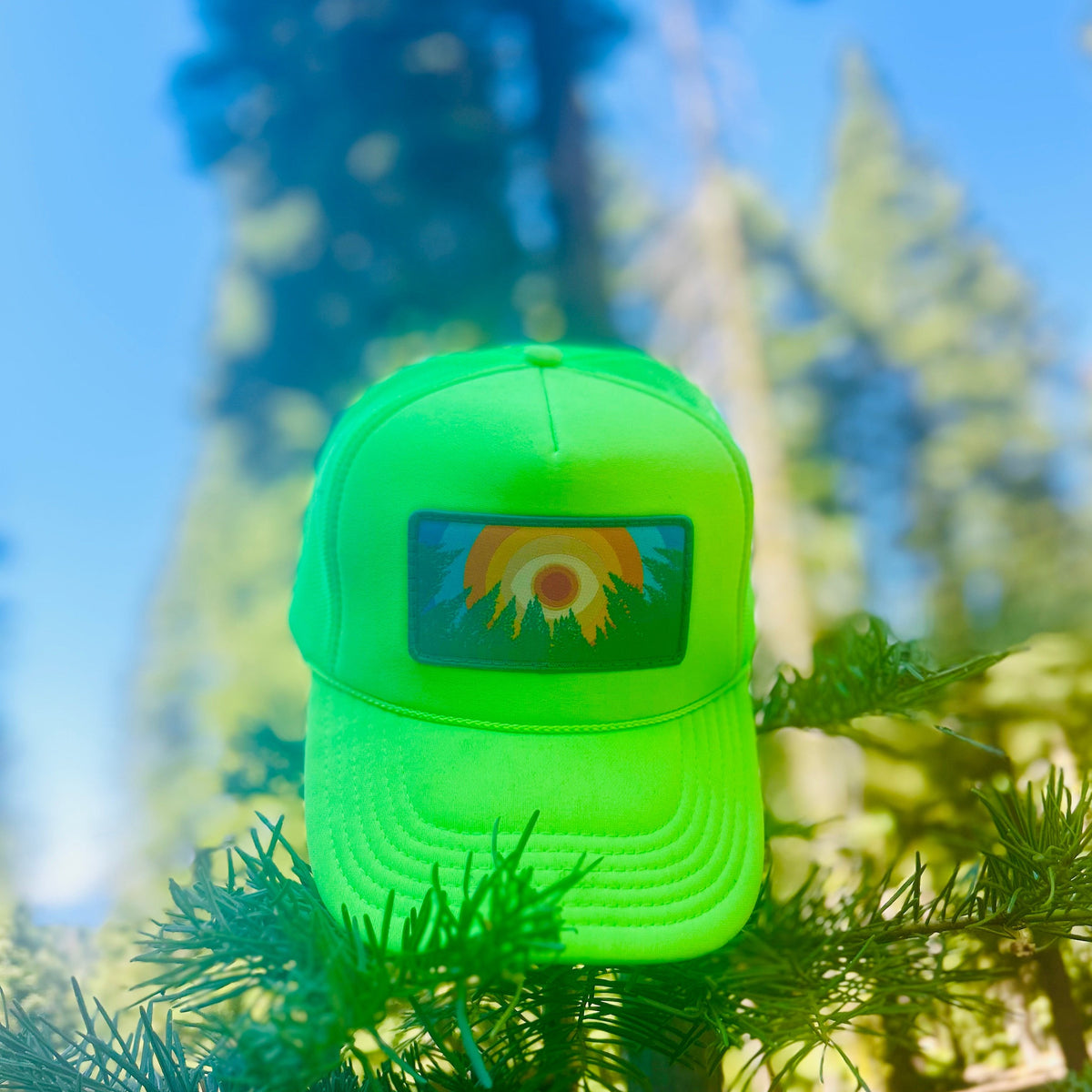 Neon green Kooh Culture foam trucker hat with the In the Trees XL patch
