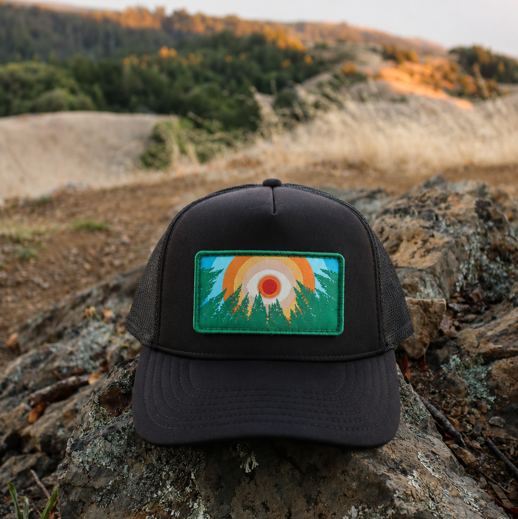 Black Kooh Culture foam trucker hat with the In the Trees XL patch