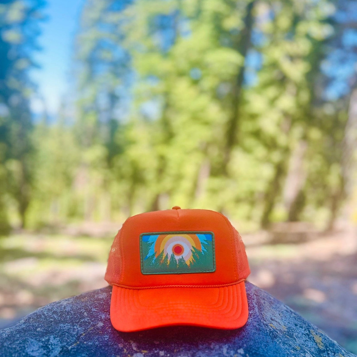 Orange Kooh Culture foam trucker hat with the In the Trees XL patch