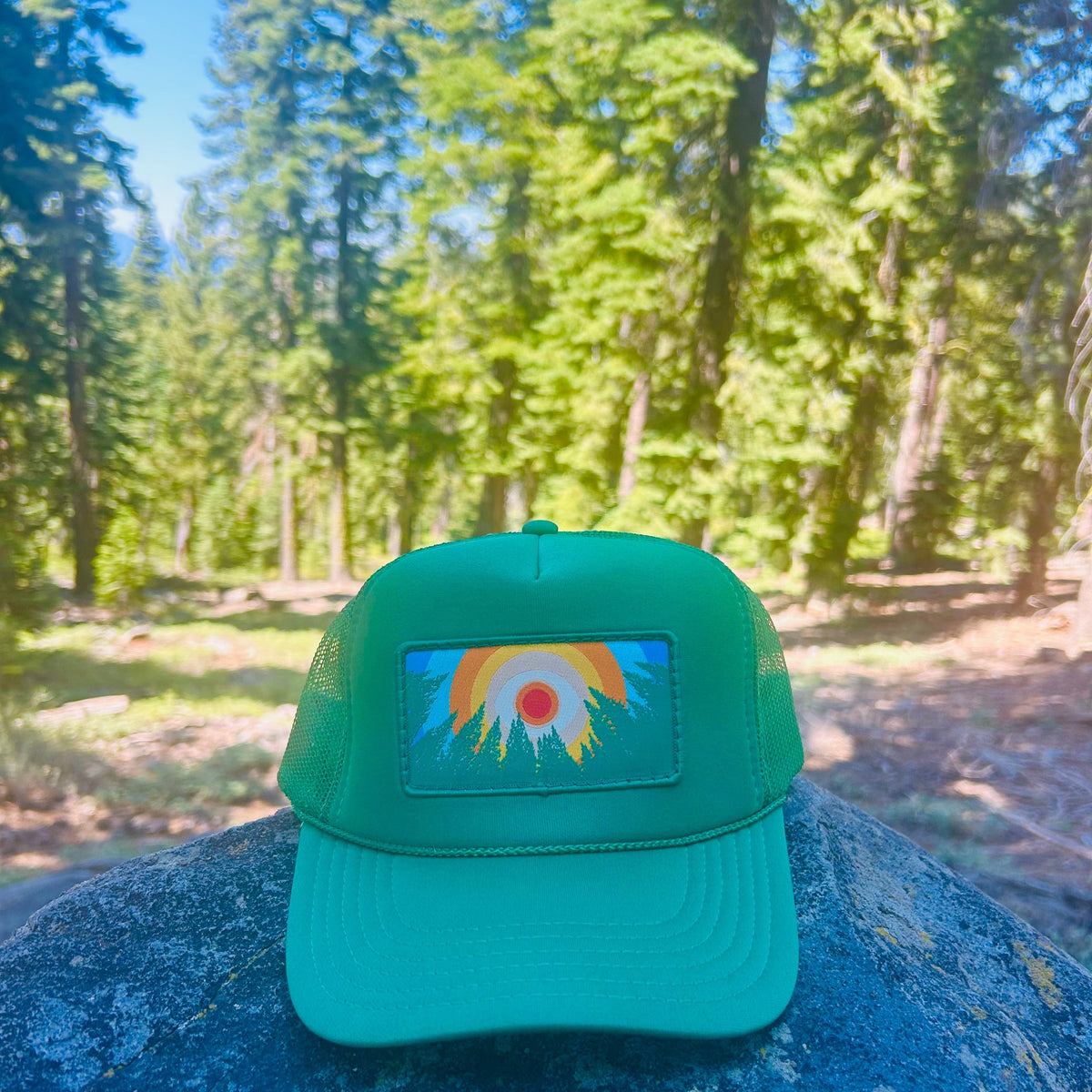 Kelly green Kooh Culture foam trucker hat with the In the Trees XL patch, alternate view