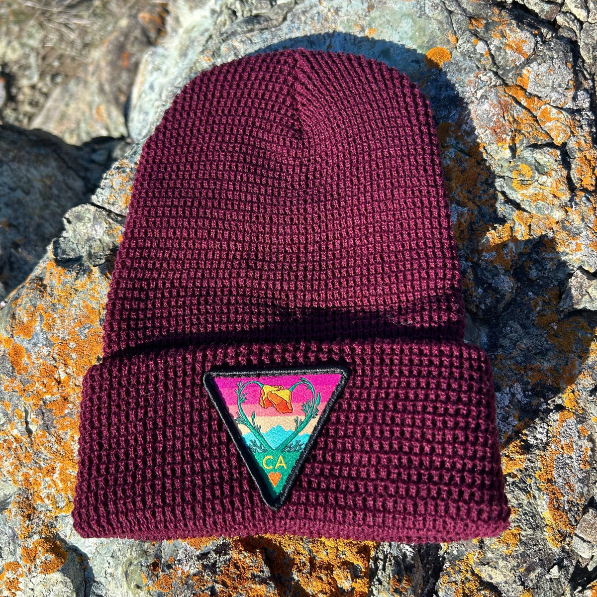 Burgundy Kooh Culture waffle cuff beanie with the Poppy CA Love patch