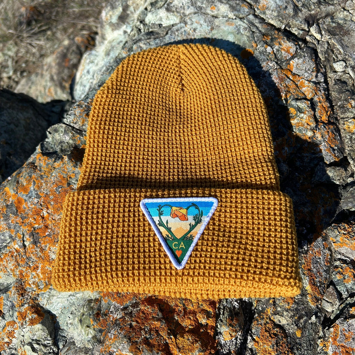 Camel Kooh Culture waffle cuff beanie with the Poppy CA Love patch