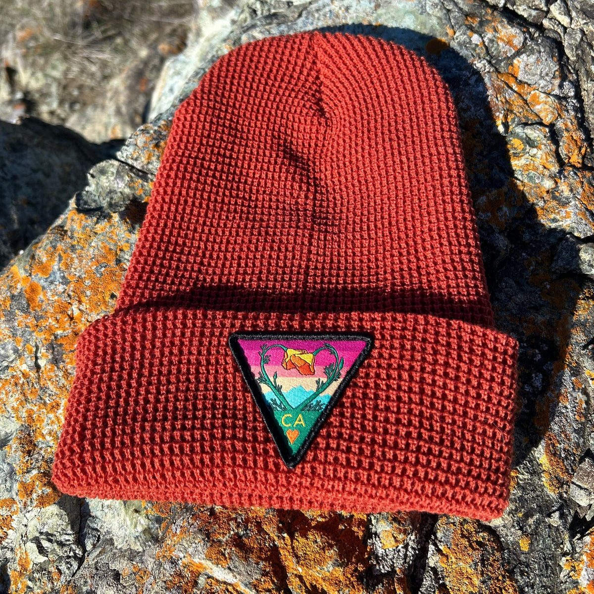 Rust Kooh Culture waffle cuff beanie with the Poppy CA Love patch