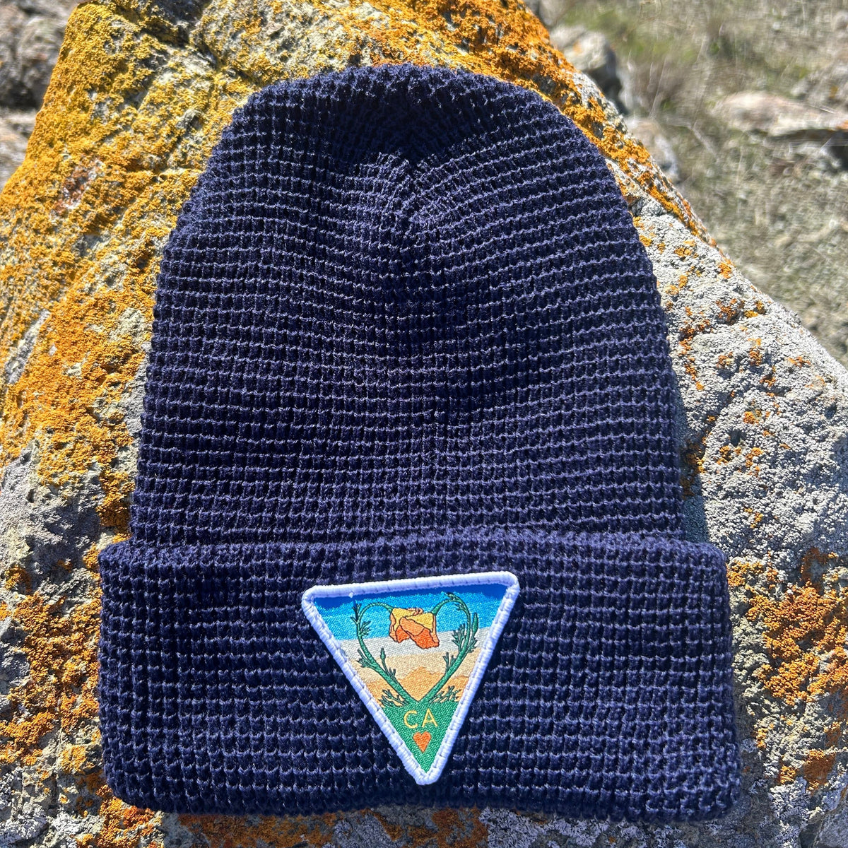 Navy Kooh Culture waffle cuff beanie with the Poppy CA Love patch