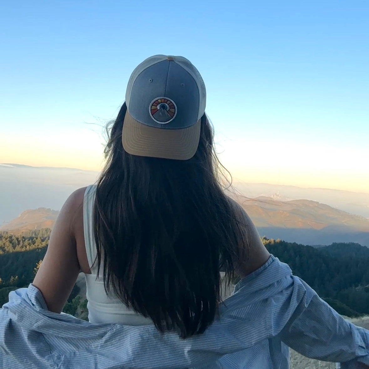 Heather gray and tan and creme Kooh Culture trucker hat with the Evil Eye Sun patch, alternate view