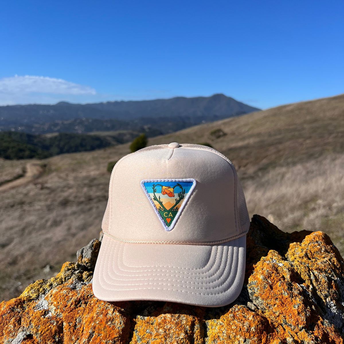 Tan Kooh Culture foam trucker hat with the Poppy CA Love patch, alternate view