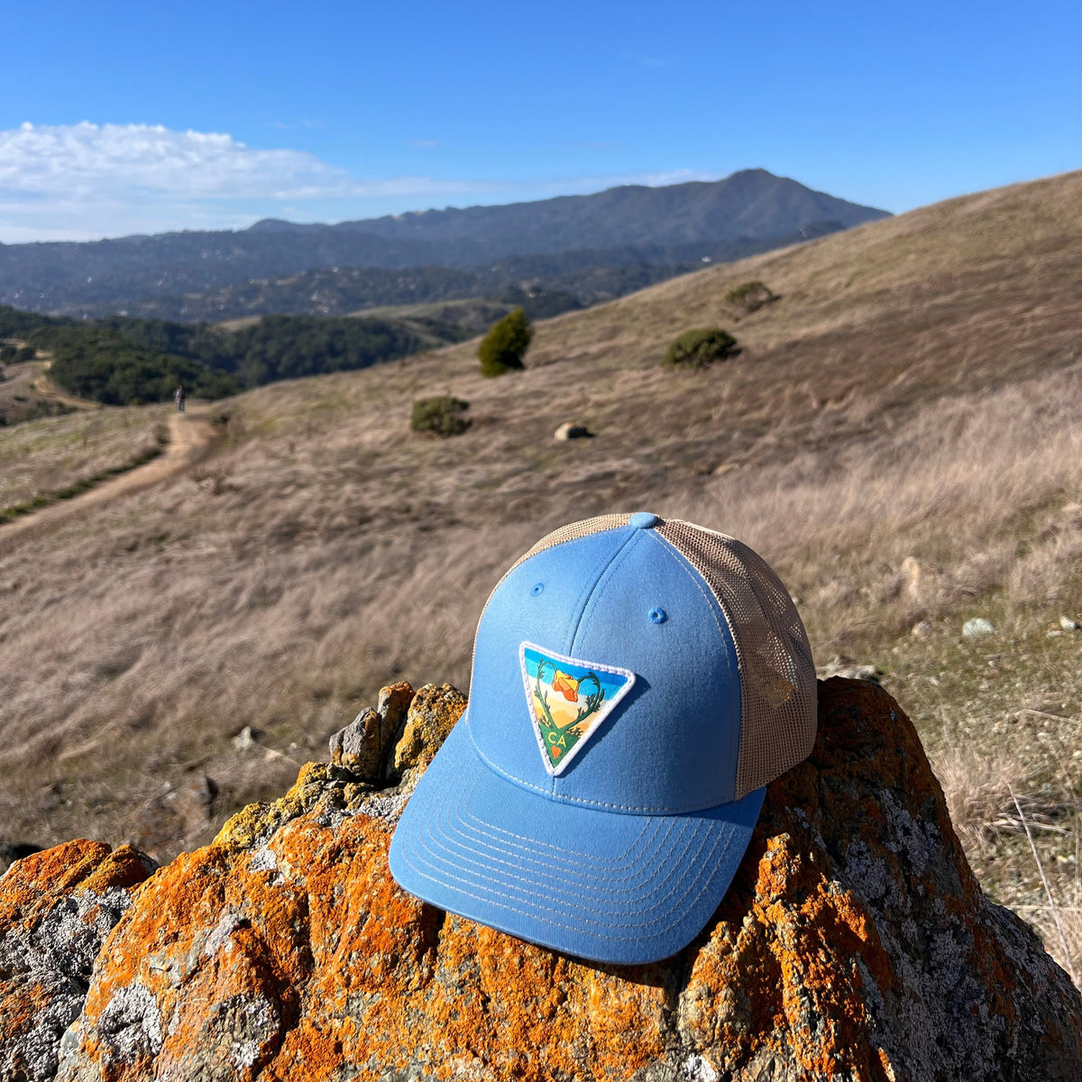 Light blue and khaki Kooh Culture trucker hat with the Poppy CA Love patch, alternate view