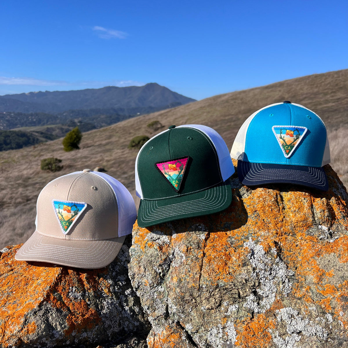 Dark green and white Kooh Culture trucker hat with the Poppy CA Love patch, alternate view