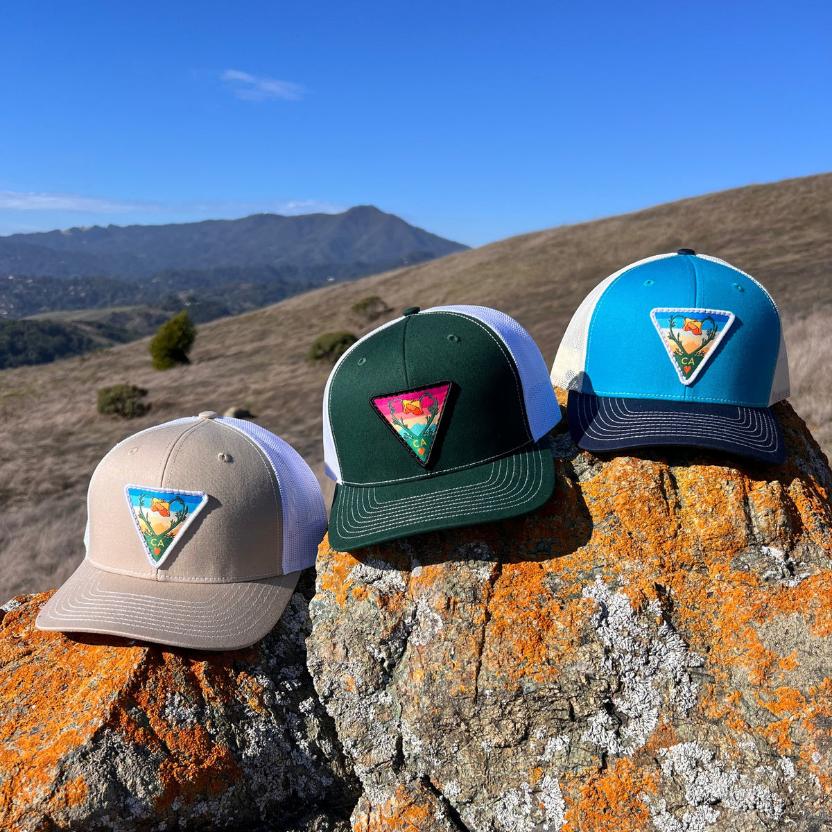Khaki and white Kooh Culture trucker hat with the Poppy CA Love patch, alternate view