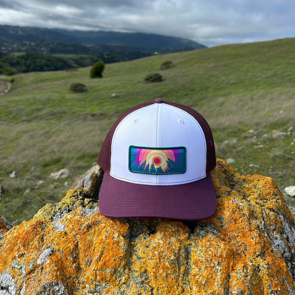 Maroon and white Kooh Culture trucker hat with the In the Trees patch