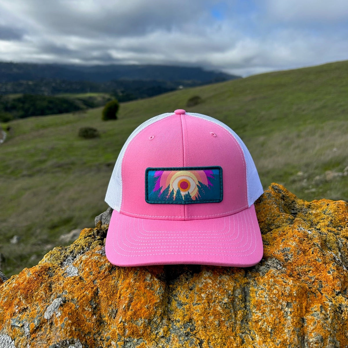 Hot pink and white Kooh Culture trucker hat with the In the Trees patch