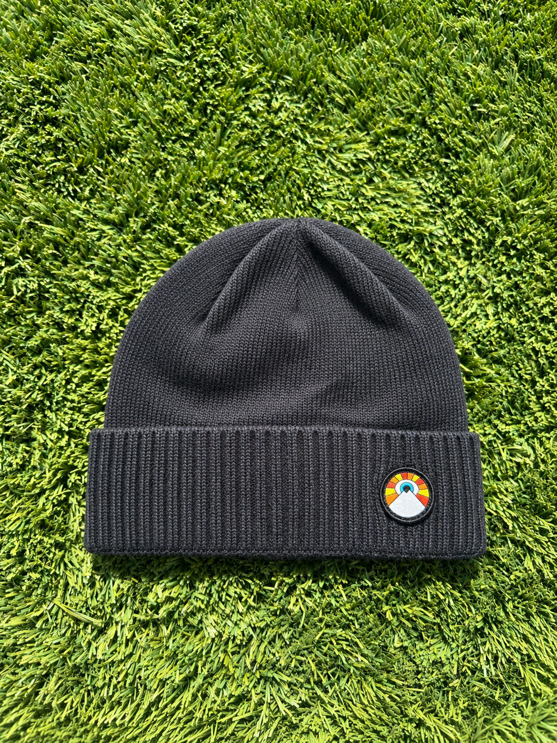 Black Kooh Culture beanie with a ribbed cuff and the Evil Eye Sun patch