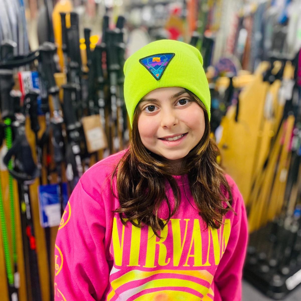 Neon yellow Kooh Culture cuffed beanie with the Poppy CA Love patch in Night Mode colours